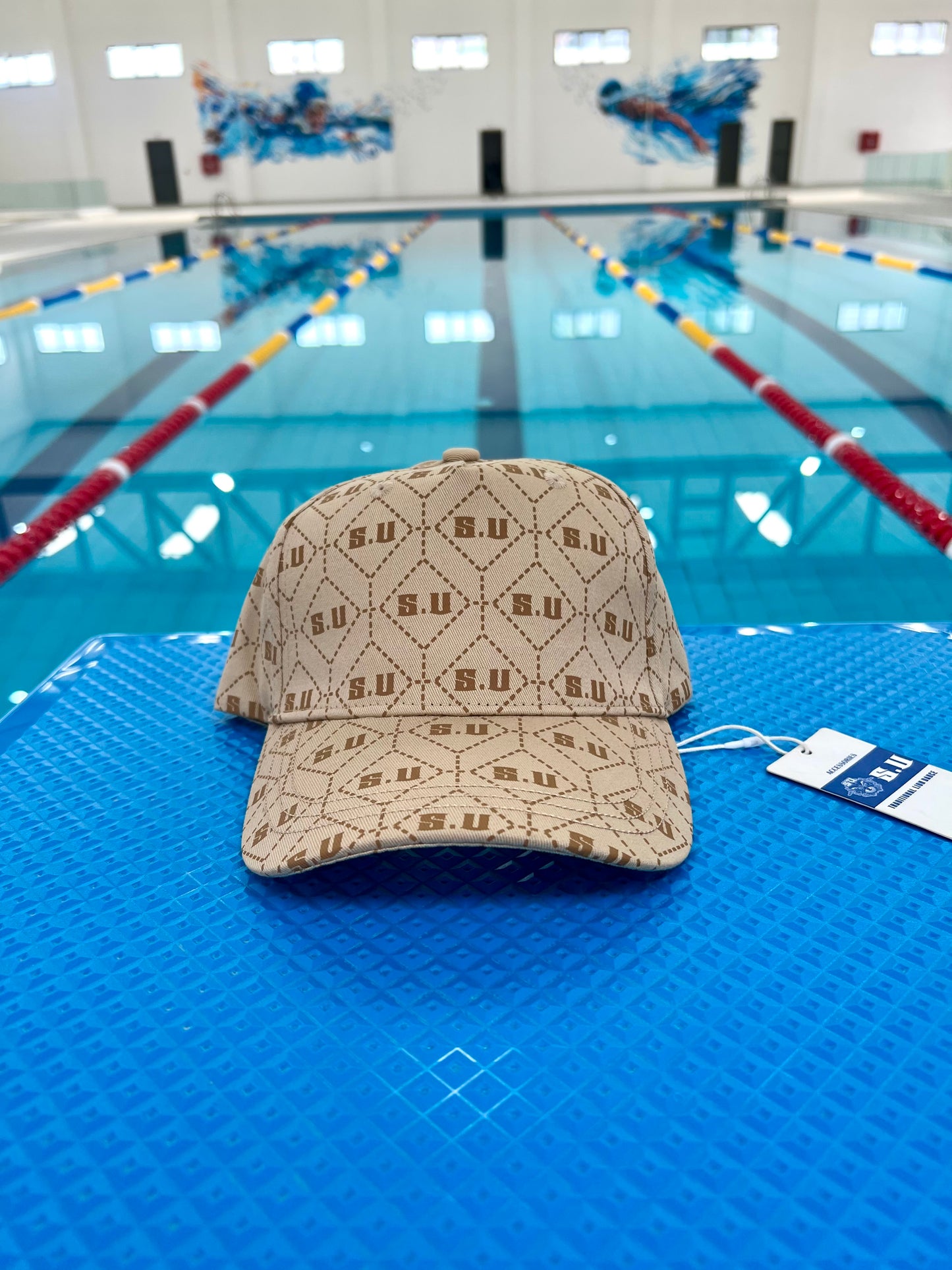 Beige Patterned Baseball Cap with “S.U” Logo