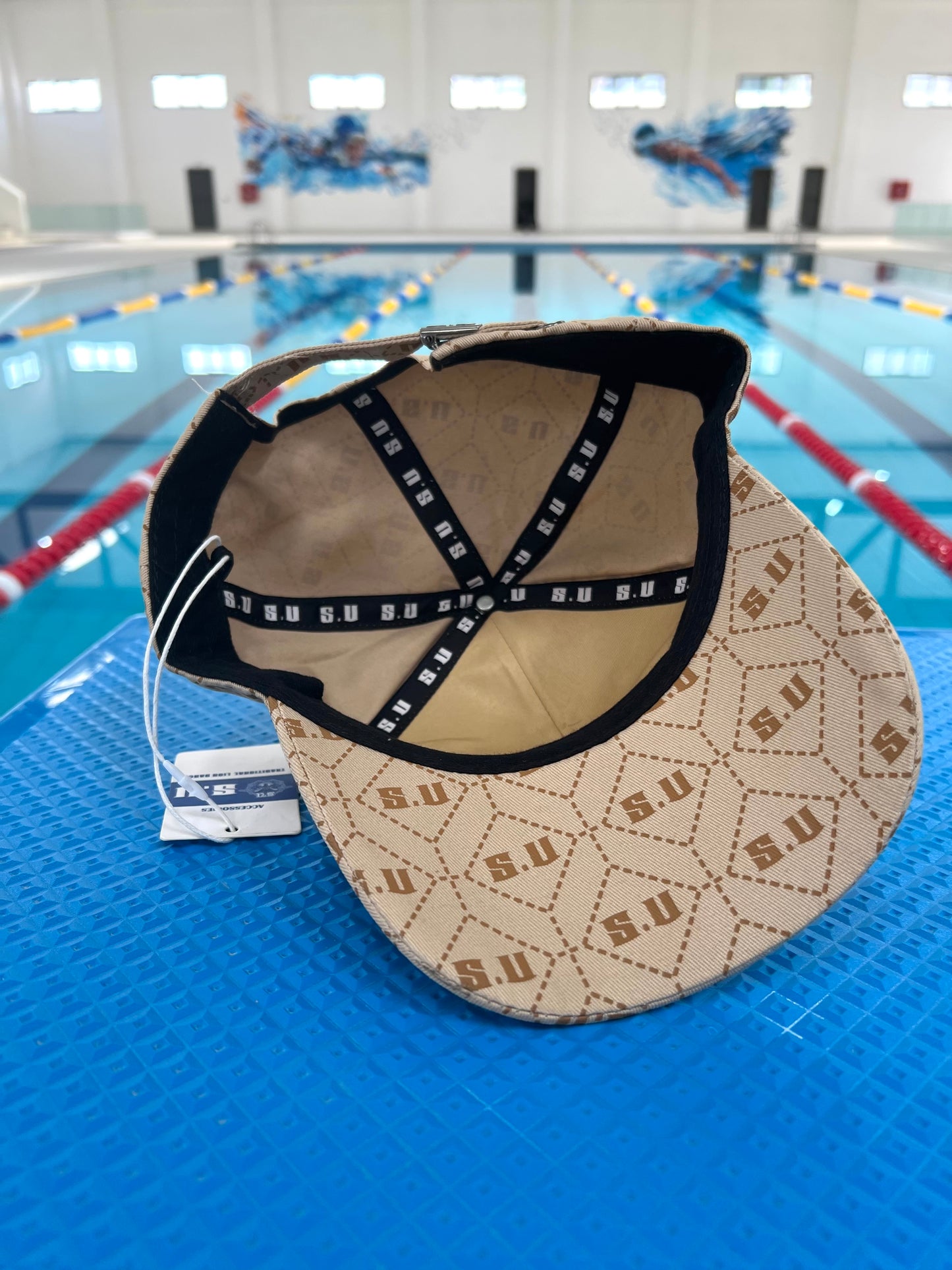 Beige Patterned Baseball Cap with “S.U” Logo